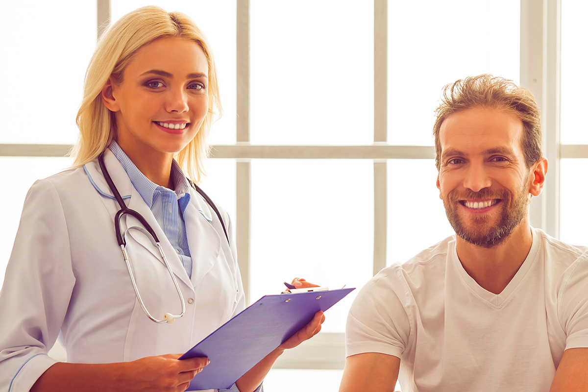 A doctor and his patient in a portrait while an examination appointment.