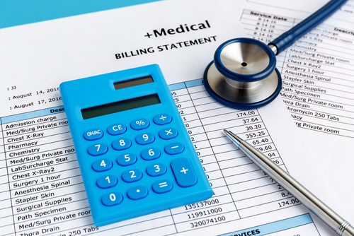 A file with an ecg report, stratoscope, laptop, and a pen is placed on a FYHBAoffice table